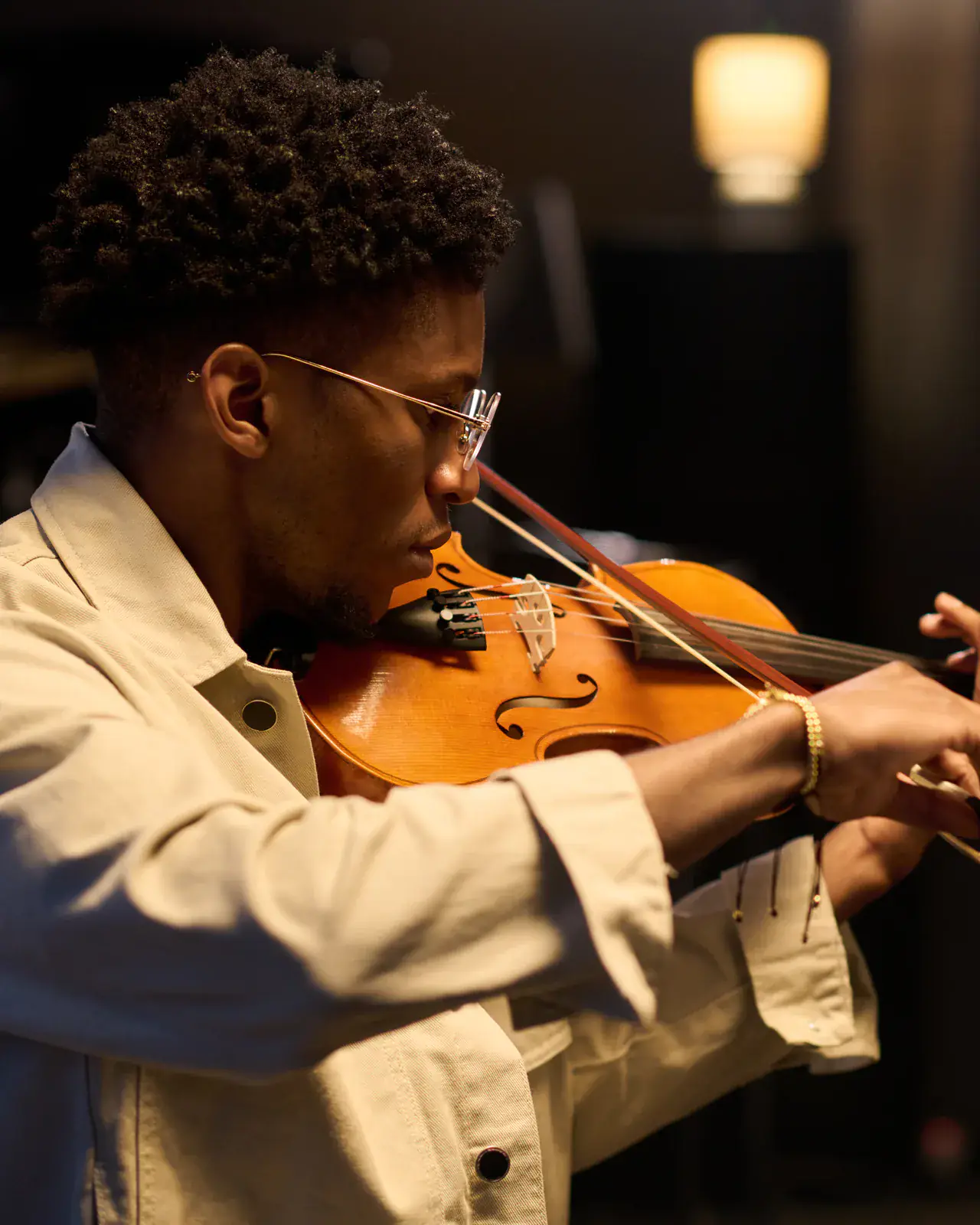 Young violinist focused in a studio — ABRSM mock exam adjudication by Concerto Music Place