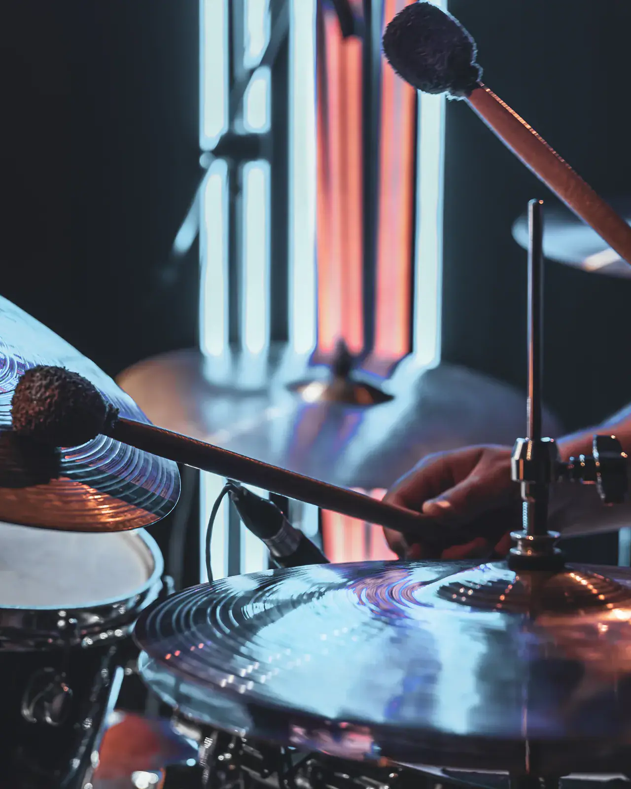 Drummer playing cymbals on stage at a concert — Concerto Music Place music-festival adjudication