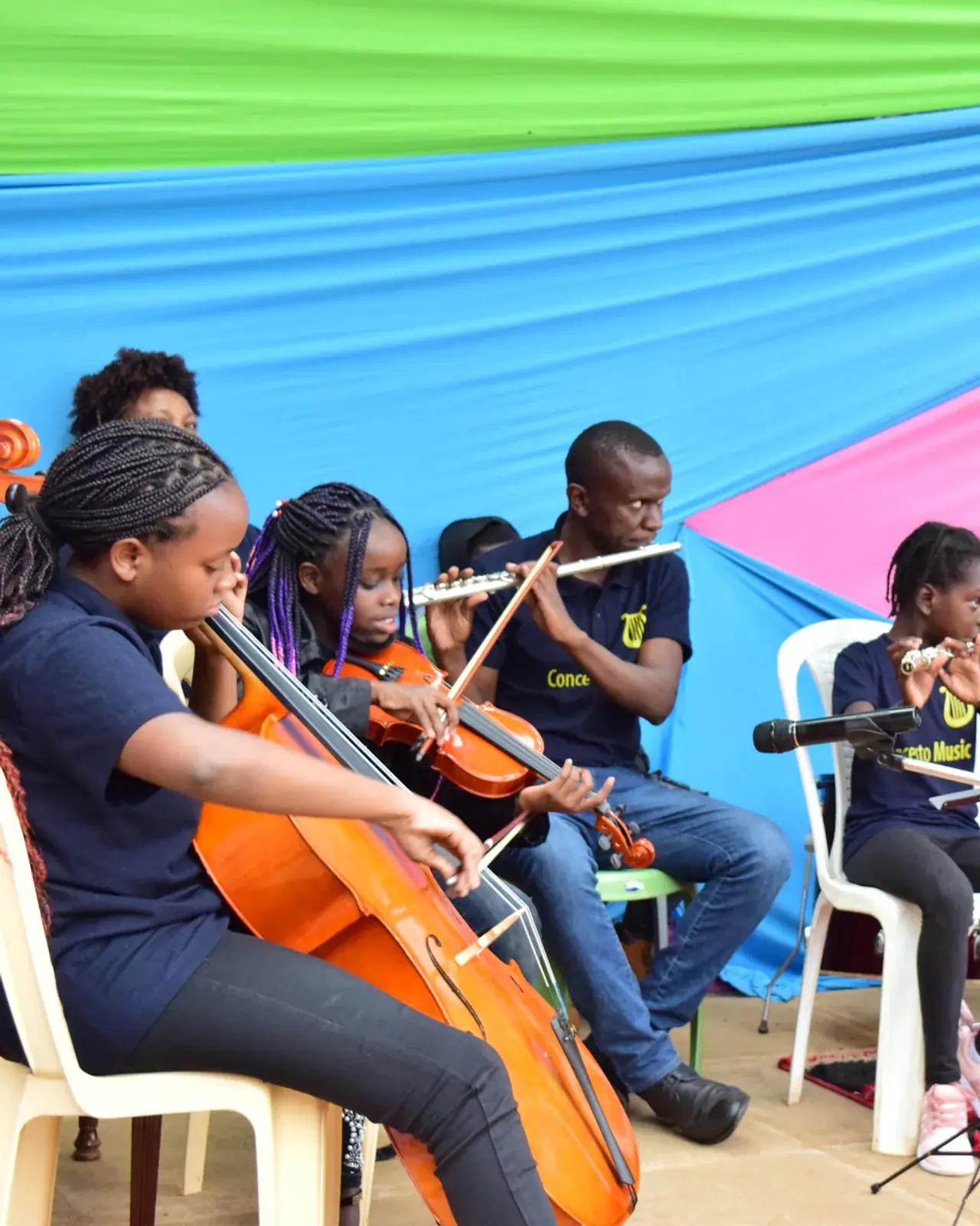 Violin orchestra in performance — instrumental ensemble coaching by Concerto Music Place