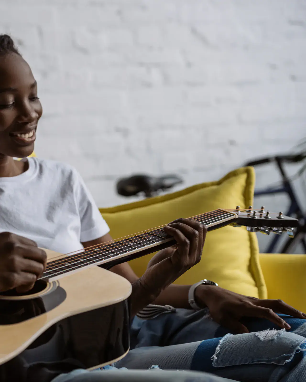 Couple relaxing and playing guitar at home — in-home music lessons in Milimani, Nairobi