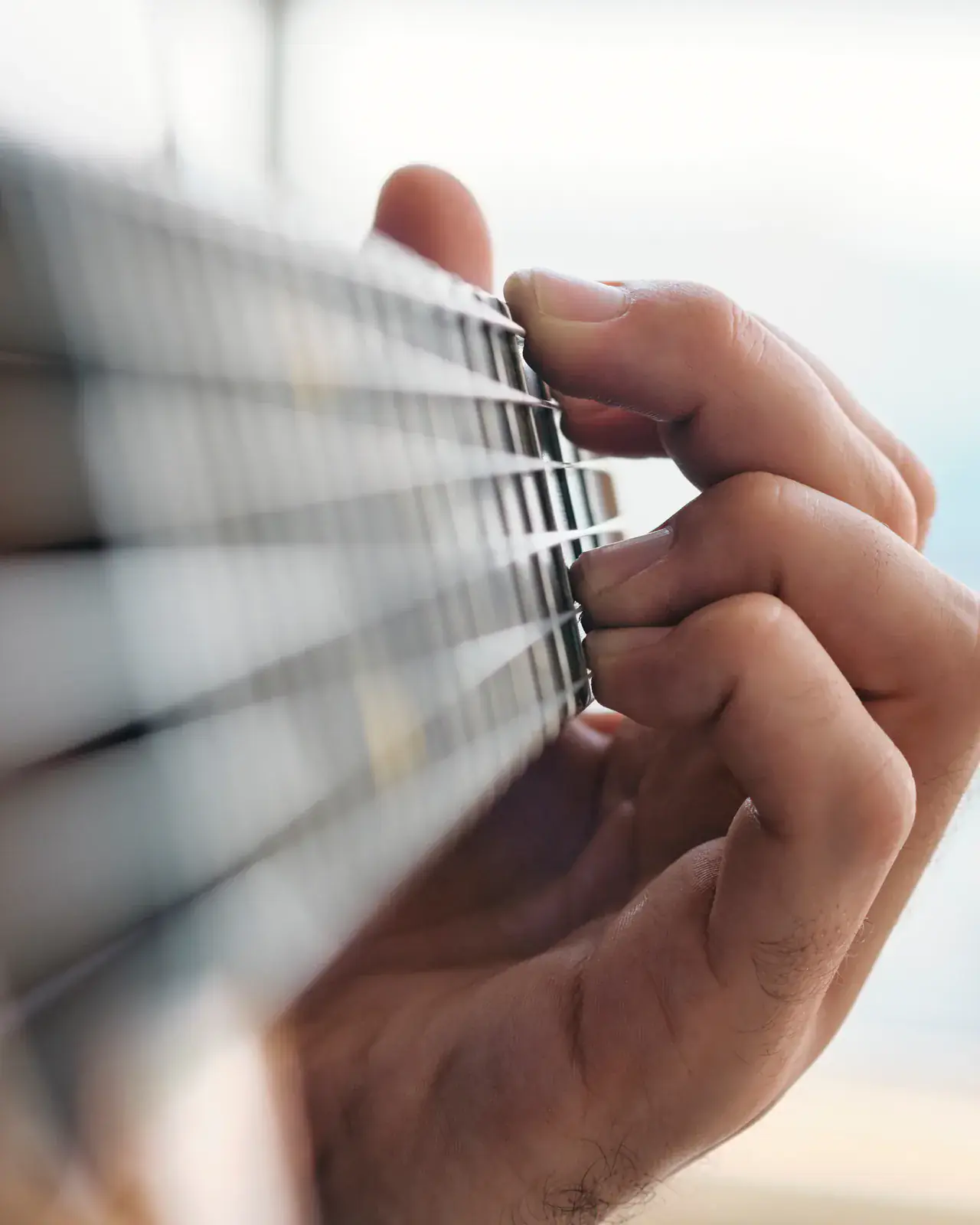 Guitarist mid-performance — meet the music trainers at Concerto Music Place
