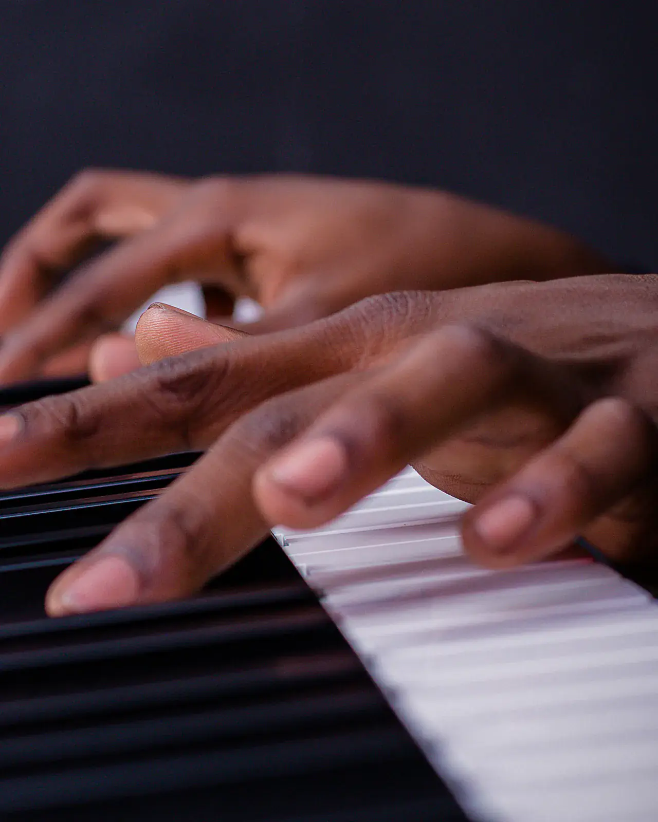 Hands playing piano keys in close-up — piano lessons at Concerto Music Place, Kikuyu